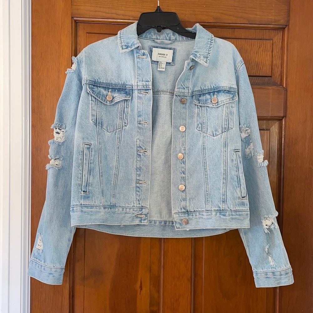Ripped denim jean jacket light wash